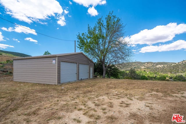 garage featuring a mountain view