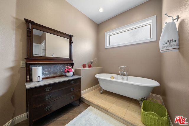 bathroom featuring a tub and tile patterned flooring