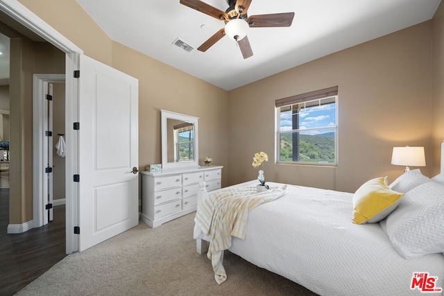 bedroom featuring ceiling fan and carpet flooring