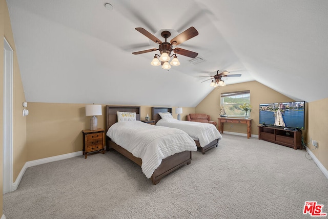 carpeted bedroom with vaulted ceiling and ceiling fan