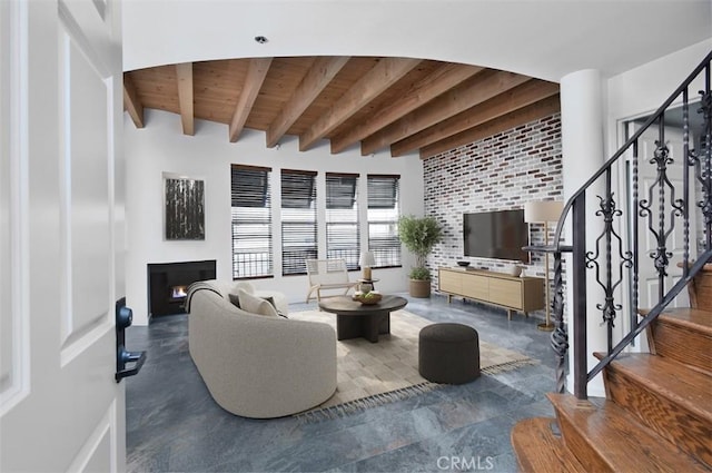 living room featuring beam ceiling and wood ceiling