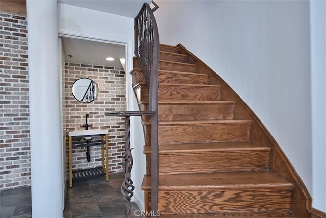 stairway with brick wall