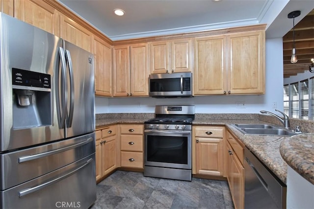 kitchen with appliances with stainless steel finishes, light brown cabinetry, ornamental molding, pendant lighting, and sink