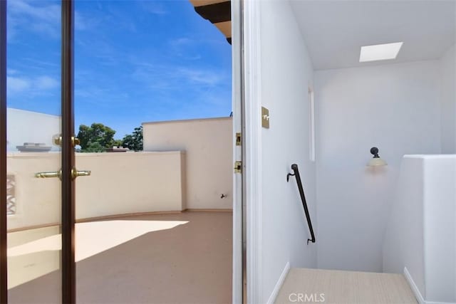 bathroom featuring a skylight