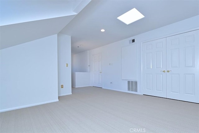 bonus room featuring light colored carpet