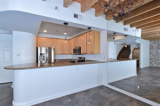 kitchen with pendant lighting, kitchen peninsula, beamed ceiling, an inviting chandelier, and appliances with stainless steel finishes