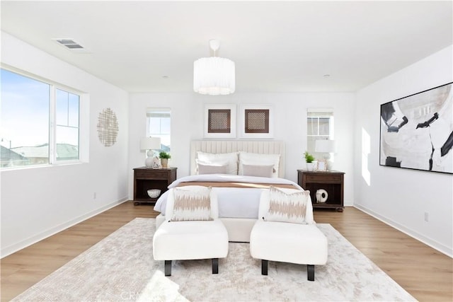 bedroom with wood-type flooring