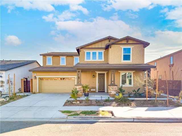 craftsman-style house featuring a porch and a garage