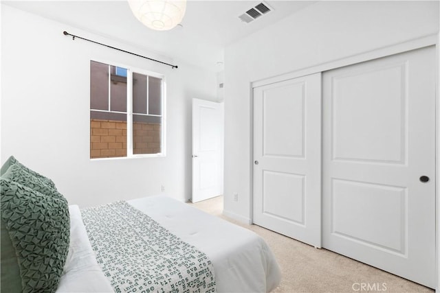 carpeted bedroom featuring a closet