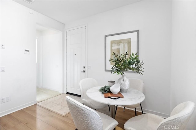 dining area featuring hardwood / wood-style floors