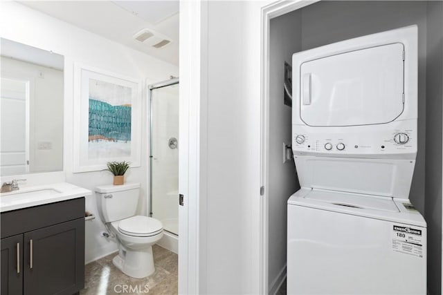 laundry area with stacked washing maching and dryer and sink