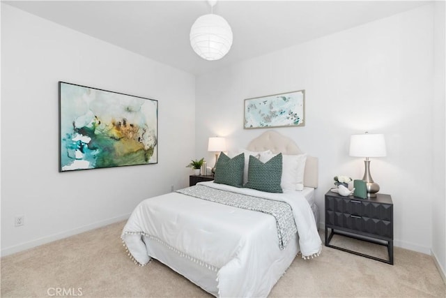 bedroom featuring light colored carpet