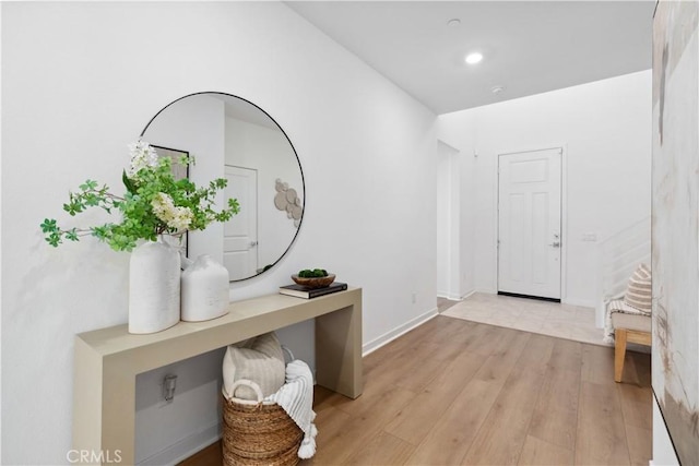 foyer entrance with light hardwood / wood-style flooring