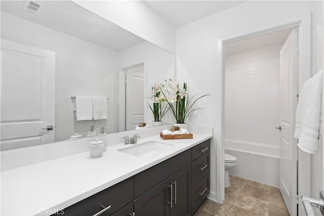 bathroom with toilet and vanity