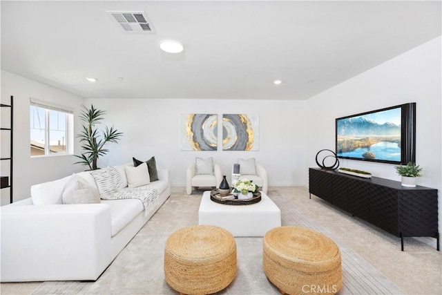 living room featuring light carpet