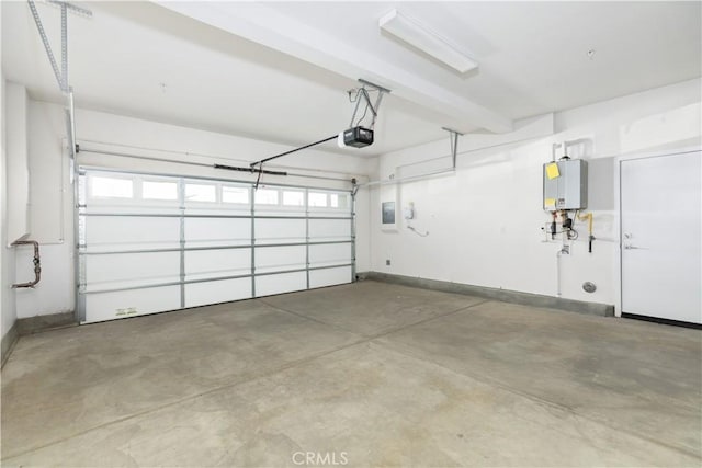 garage featuring a garage door opener and tankless water heater