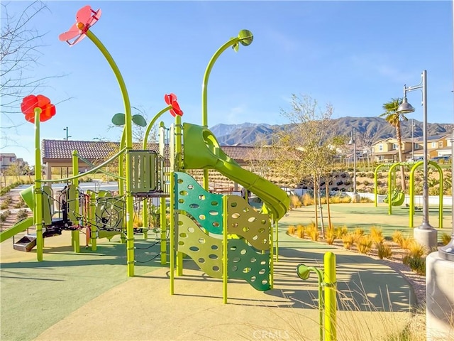 view of jungle gym featuring a mountain view