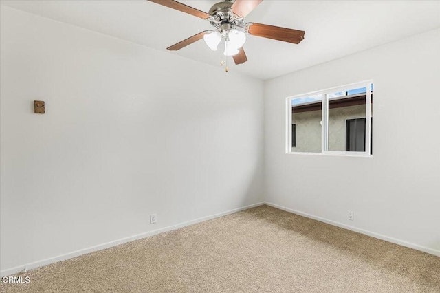 empty room with ceiling fan and carpet flooring