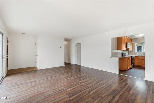 unfurnished living room with hardwood / wood-style flooring