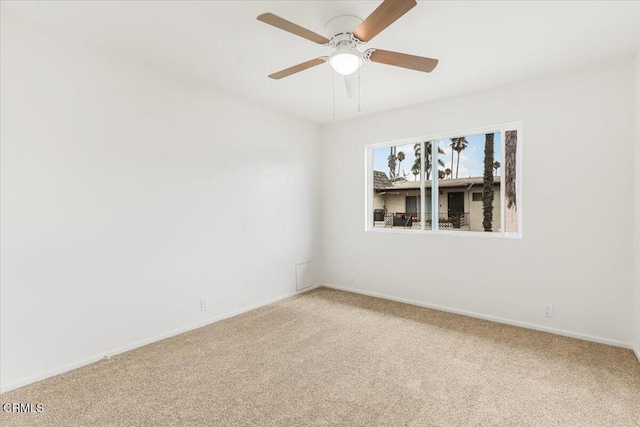 carpeted empty room with ceiling fan