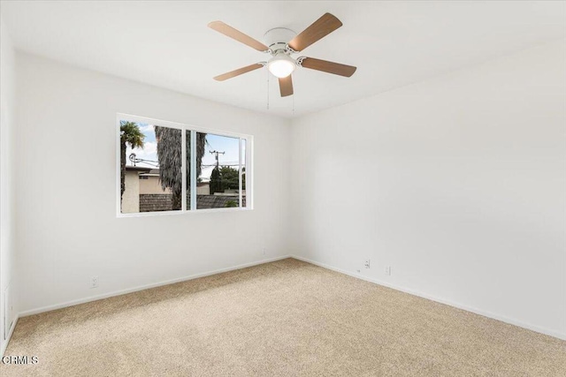 empty room with carpet and ceiling fan