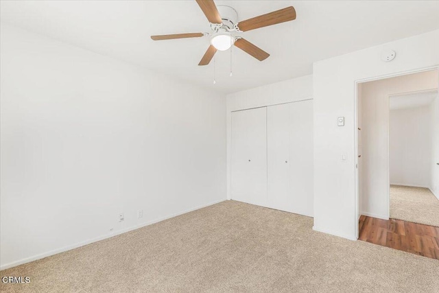 unfurnished bedroom with ceiling fan, a closet, and light carpet