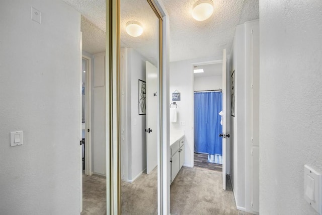 bathroom featuring vanity and a textured ceiling