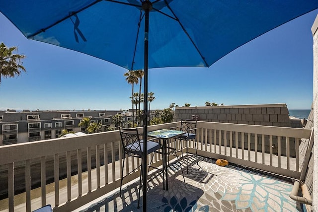 balcony featuring a water view