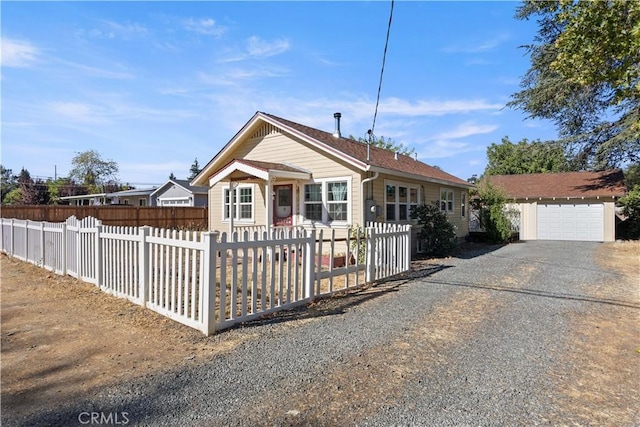 view of front of house featuring an outdoor structure and a garage