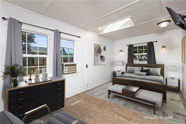 bedroom featuring cooling unit and hardwood / wood-style floors