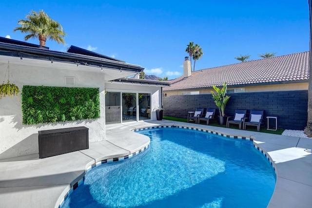 view of swimming pool featuring a patio