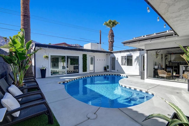 view of swimming pool with a patio