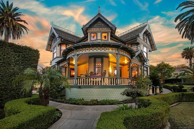 victorian-style house featuring a porch