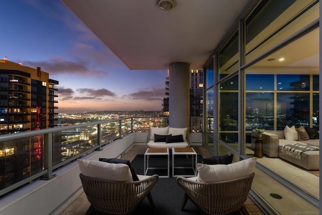 balcony at dusk with an outdoor hangout area