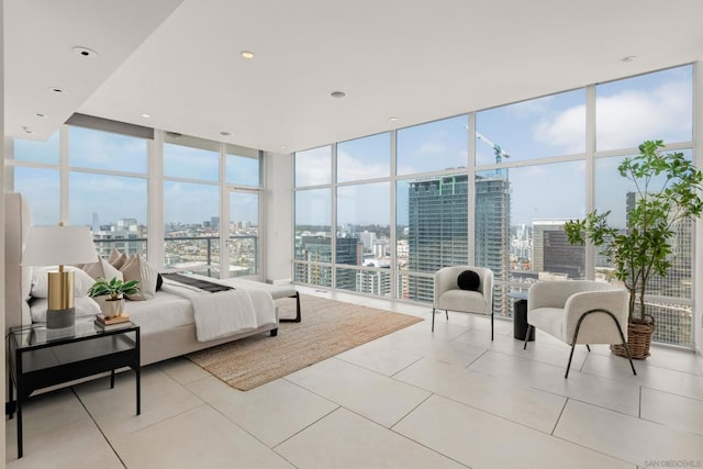 tiled bedroom featuring floor to ceiling windows