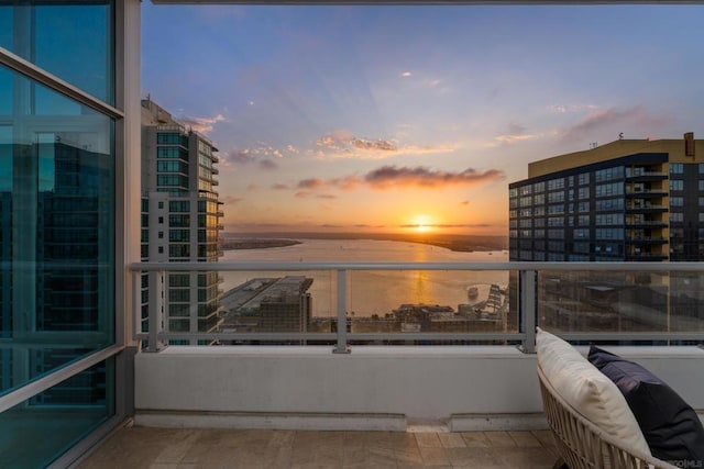 balcony at dusk with a water view