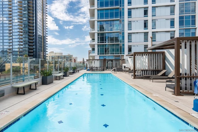 view of swimming pool with a patio