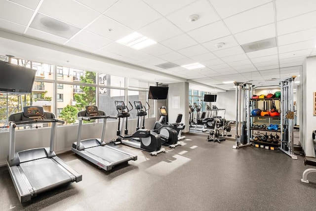 exercise room featuring a drop ceiling