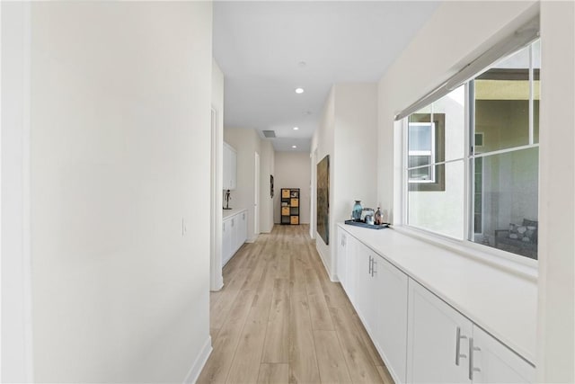 hallway featuring light hardwood / wood-style flooring