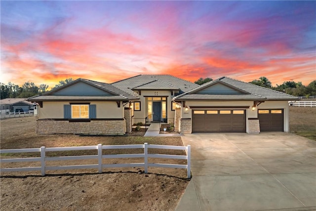 prairie-style house featuring a garage