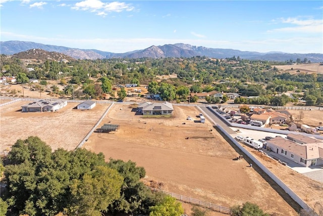 birds eye view of property with a mountain view