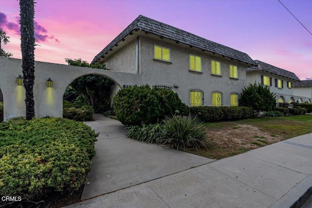 view of property exterior at dusk