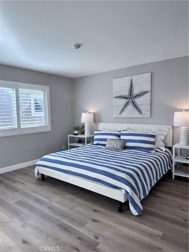 bedroom featuring hardwood / wood-style flooring