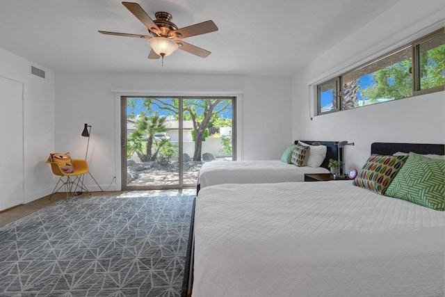 bedroom with access to outside and ceiling fan