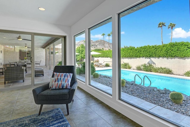 sunroom featuring a mountain view