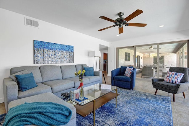 living room featuring tile patterned floors and ceiling fan