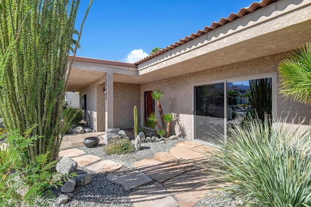 property entrance with a patio