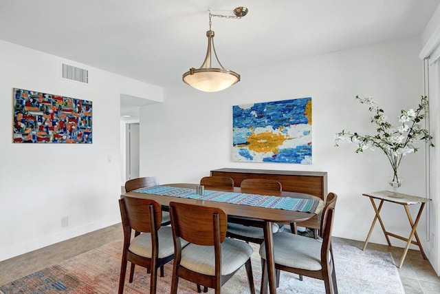 dining room featuring light tile patterned flooring