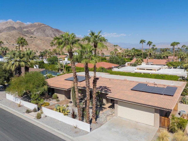 birds eye view of property featuring a mountain view