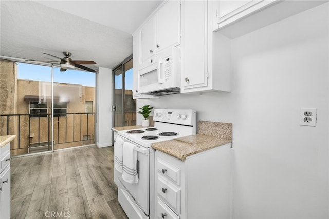 kitchen featuring ceiling fan, white appliances, white cabinets, a textured ceiling, and light hardwood / wood-style flooring